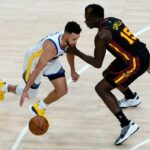 通博-體育-美國籃球明星發聲支持亞裔穿李小龍標識運動鞋參賽